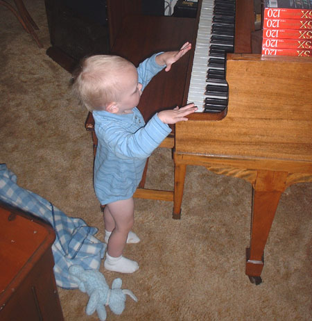 Atticus playing the piano.jpg 70.7K